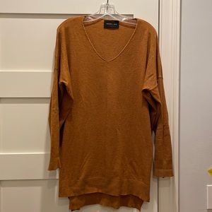 Goldenrod tunic sweater with V neck, center seam and banding on sleeves and hem